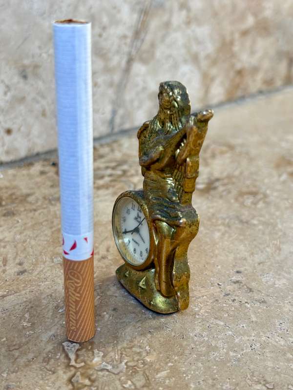 Vintage miniature quartz clock brass angel playing banjo