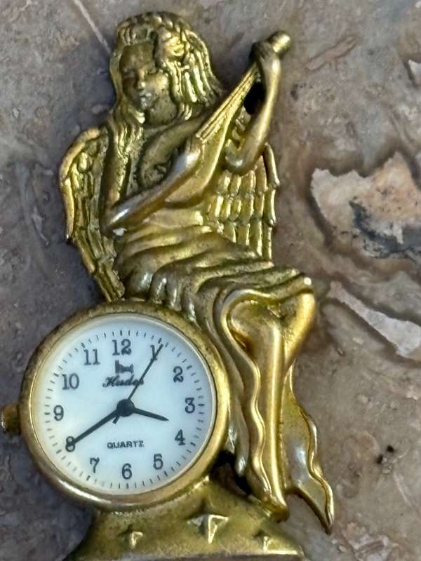 Vintage miniature quartz clock brass angel playing banjo