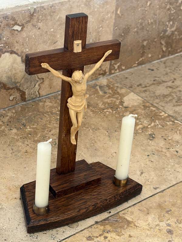 Vintage wooden crucifix with candles