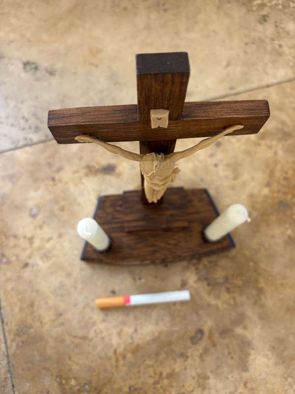 Vintage wooden crucifix with candles