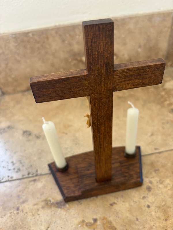 Vintage wooden crucifix with candles