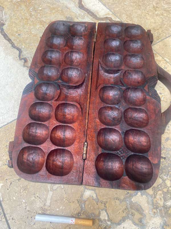 Vintage hand carved wood Mancala Bao African game board