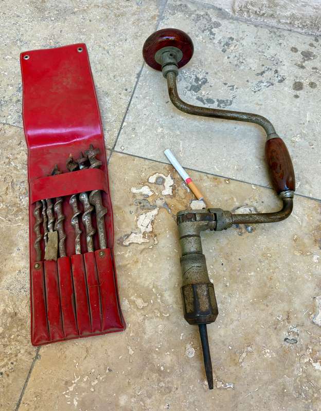 Vintage hand drill with drill bits