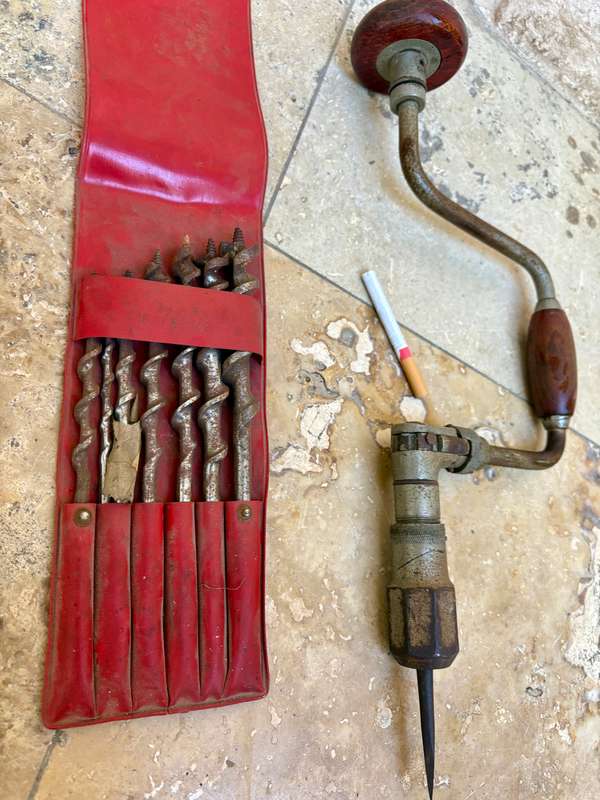 Vintage hand drill with drill bits