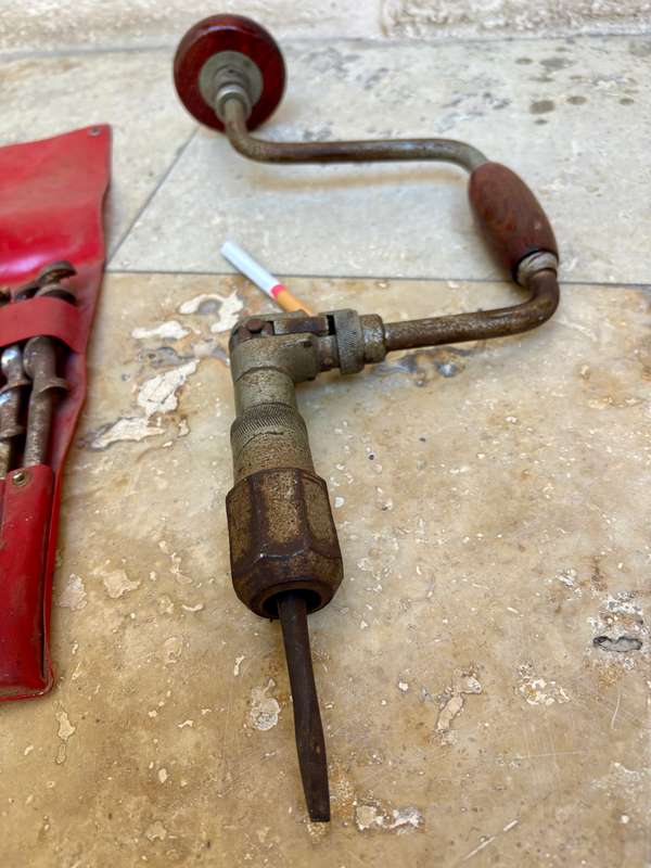 Vintage hand drill with drill bits