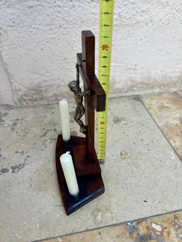 Vintage wooden crucifix with candles