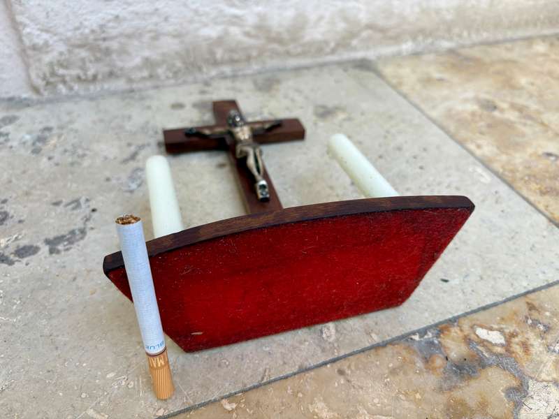 Vintage wooden crucifix with candles