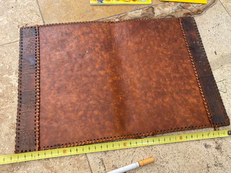 Vintage leather journal cover with prescription notes and envelopes