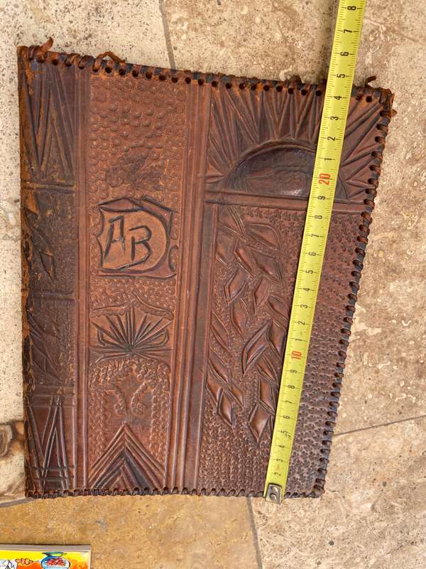 Vintage leather journal cover with prescription notes and envelopes