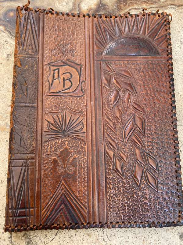 Vintage leather journal cover with prescription notes and envelopes