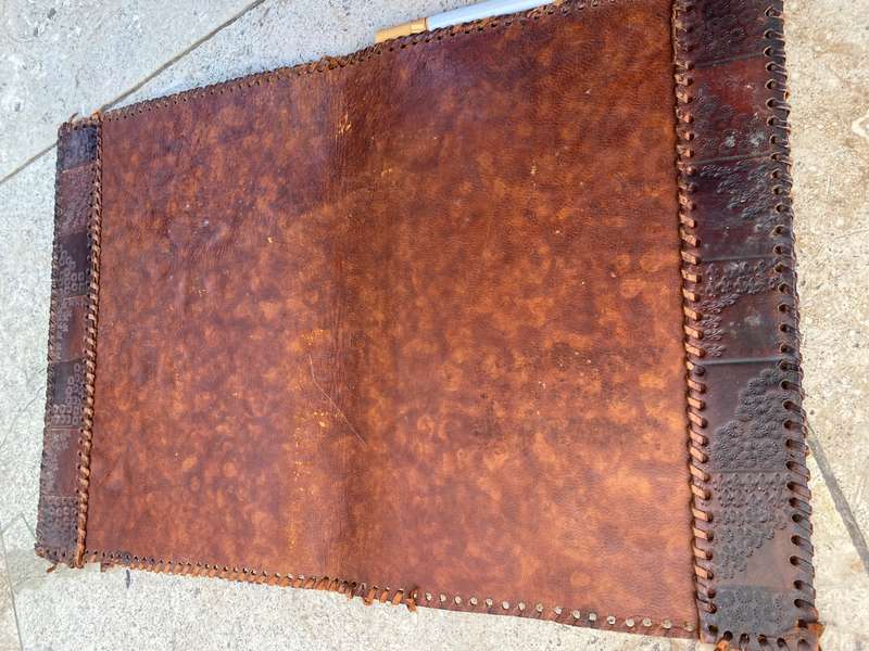 Vintage leather journal cover with prescription notes and envelopes