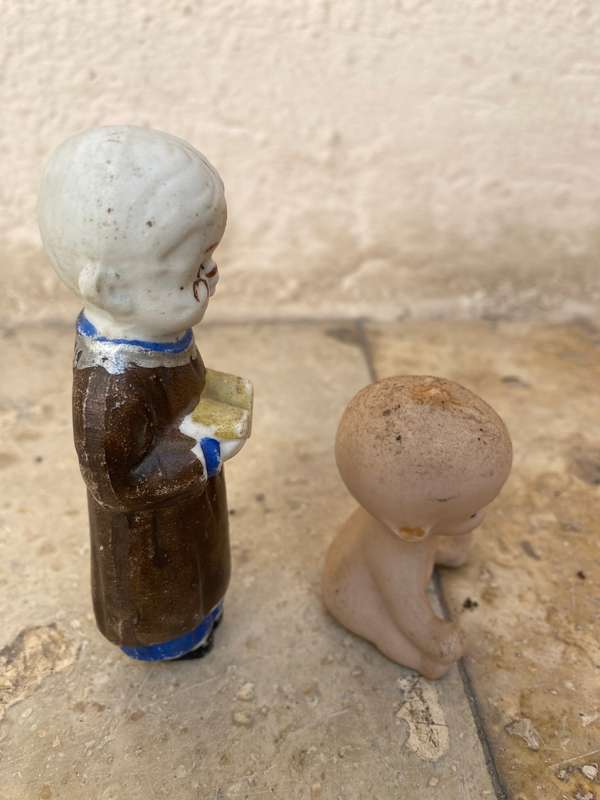 Antique Japan Bisque doll figurine pair kewpie baby and child reading figure