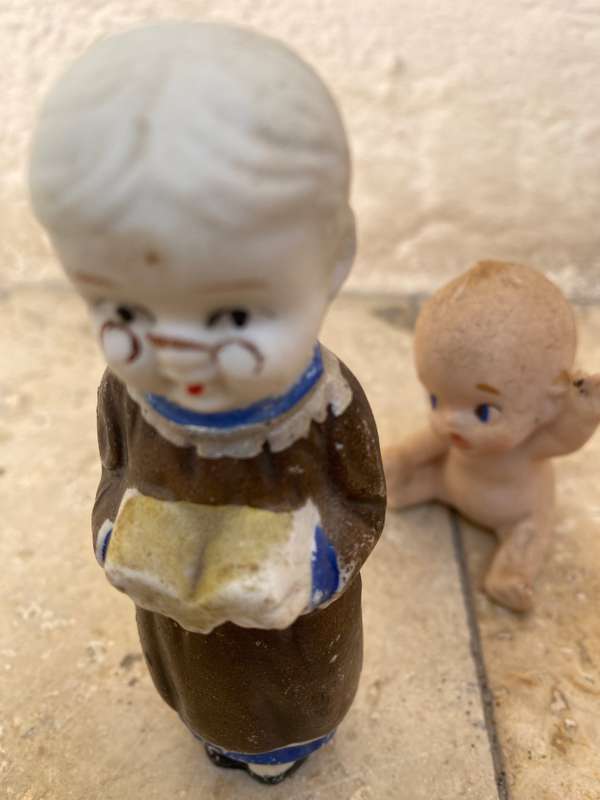 Antique Japan Bisque doll figurine pair kewpie baby and child reading figure