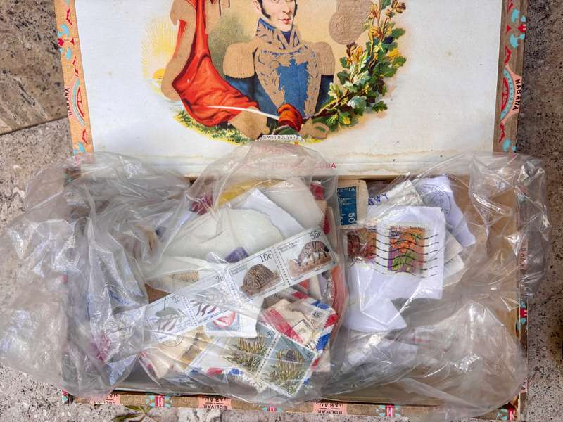 Large lot of stamps in cigar box stamp lot