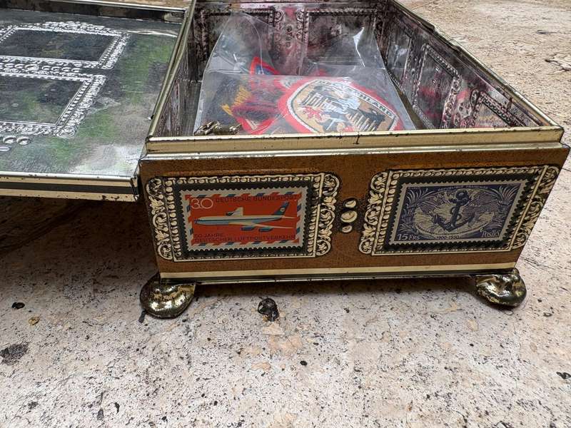 Stamp collector footed tin box with 25 travel badge lot Europe badges
