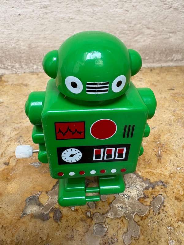 Retro tin Schylling Rowley wind up tin robot , pvc green wind up robot pair