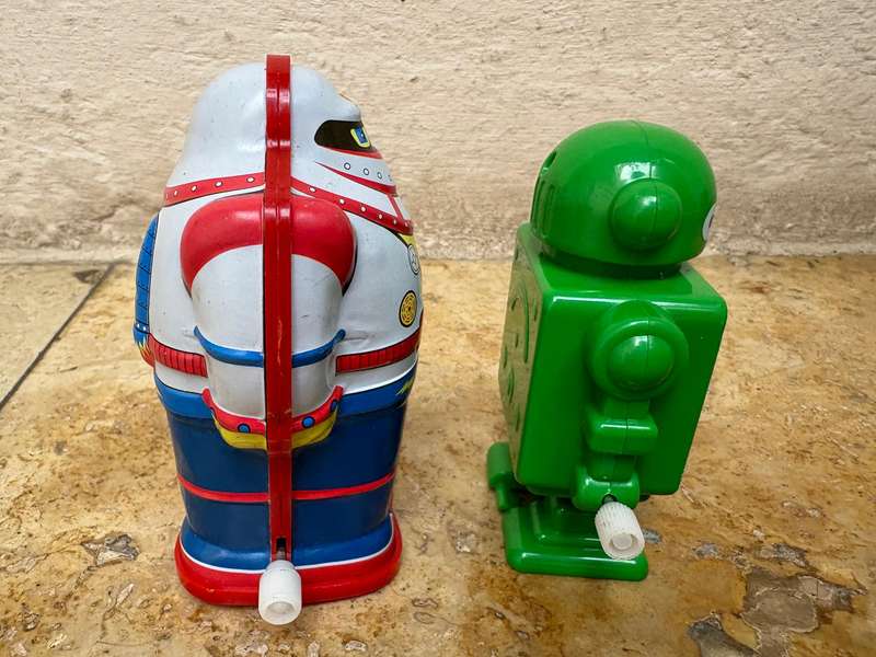 Retro tin Schylling Rowley wind up tin robot , pvc green wind up robot pair