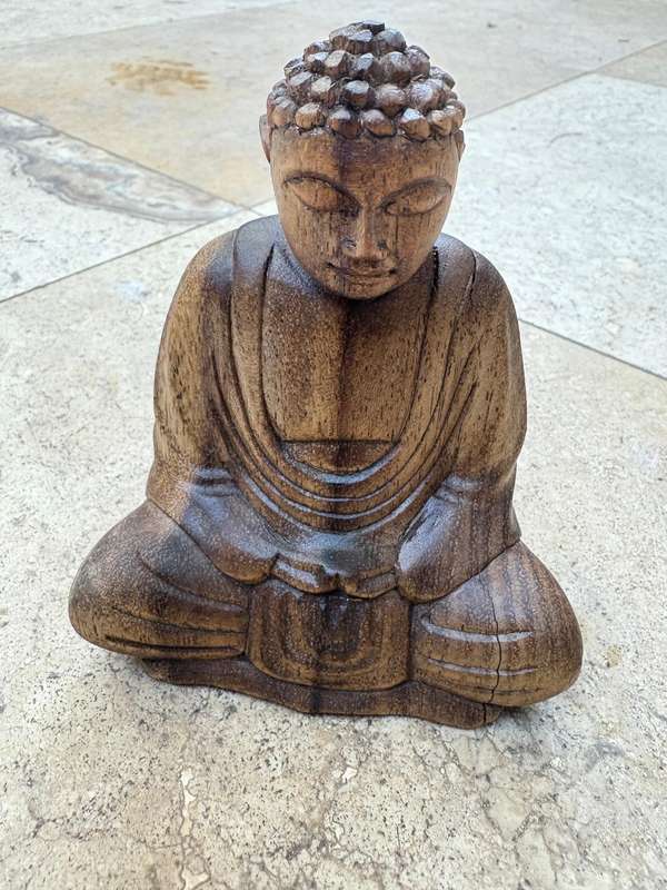 Sitting wood Buddha