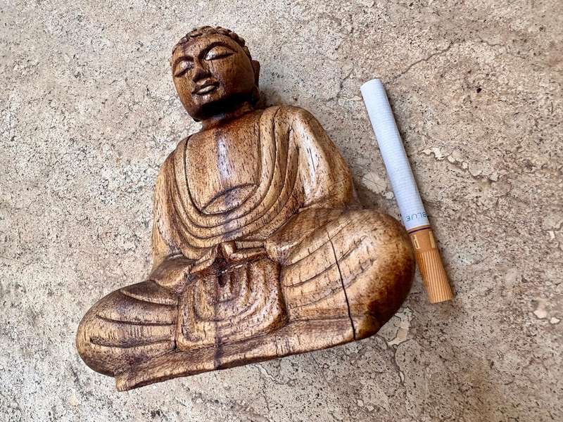 Sitting wood Buddha