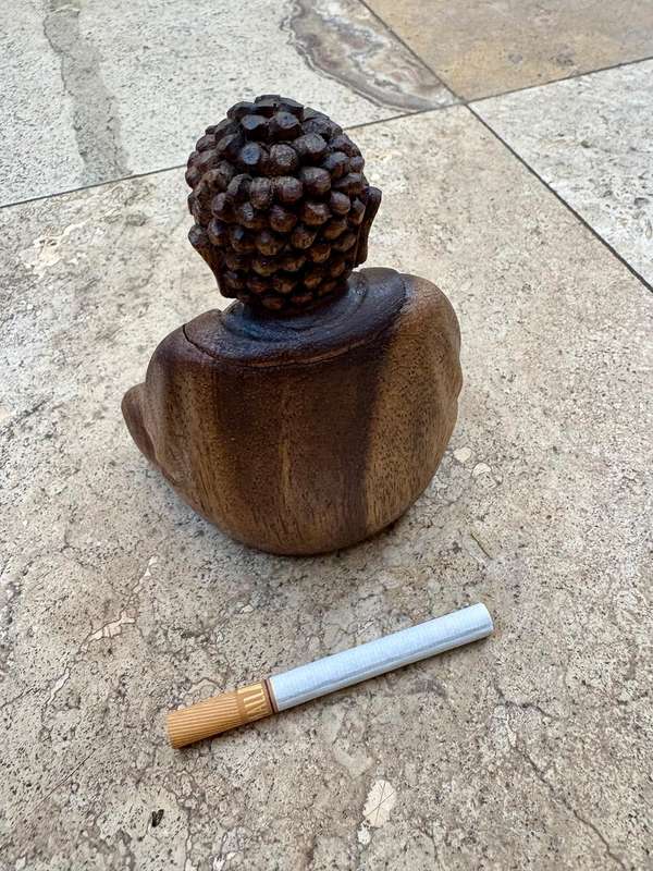 Sitting wood Buddha