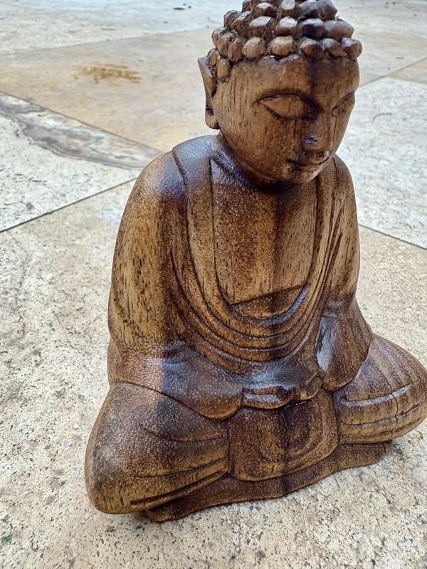 Sitting wood Buddha