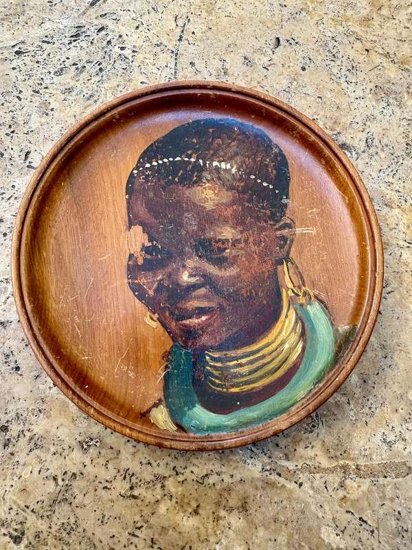 Vintage painted African portrait on wood wall plate tribe person