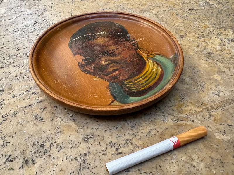 Vintage painted African portrait on wood wall plate tribe person