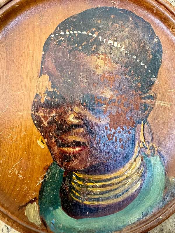 Vintage painted African portrait on wood wall plate tribe person