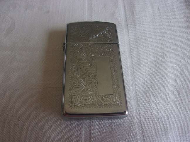 Vintage chrome Zippo lighter - floral design