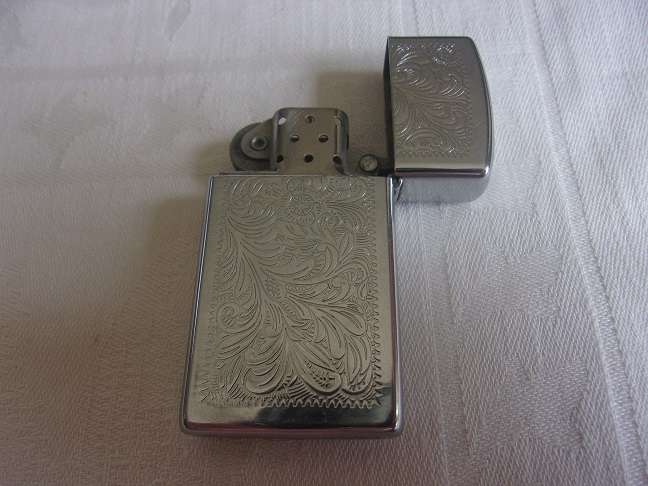 Vintage chrome Zippo lighter - floral design