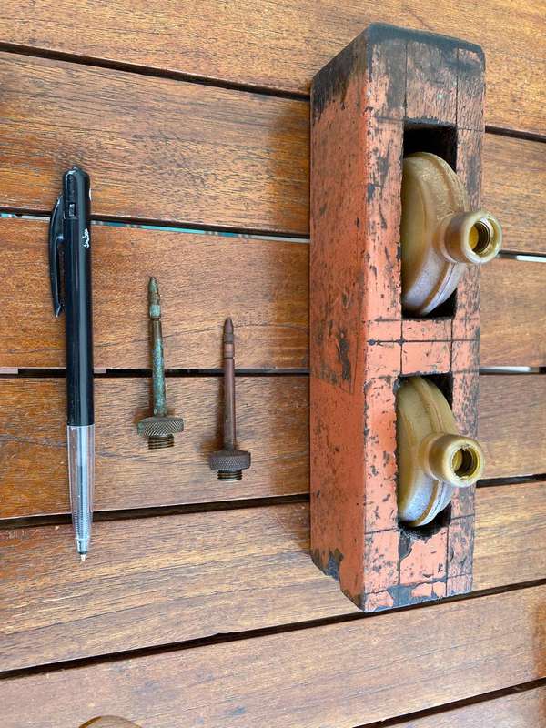 Two Oil Cans in a Stand