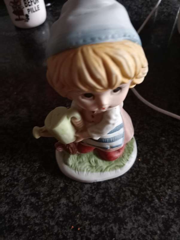 VINTAGE ORNAMENTAL GIRL WITH WATERING CAN