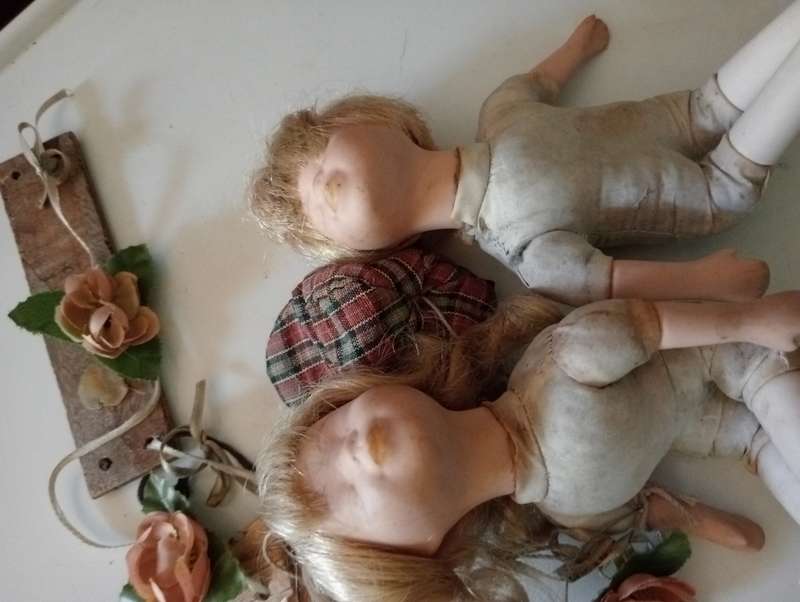 2 SMALL ANTIQUE BABY DOLLS ON SWING