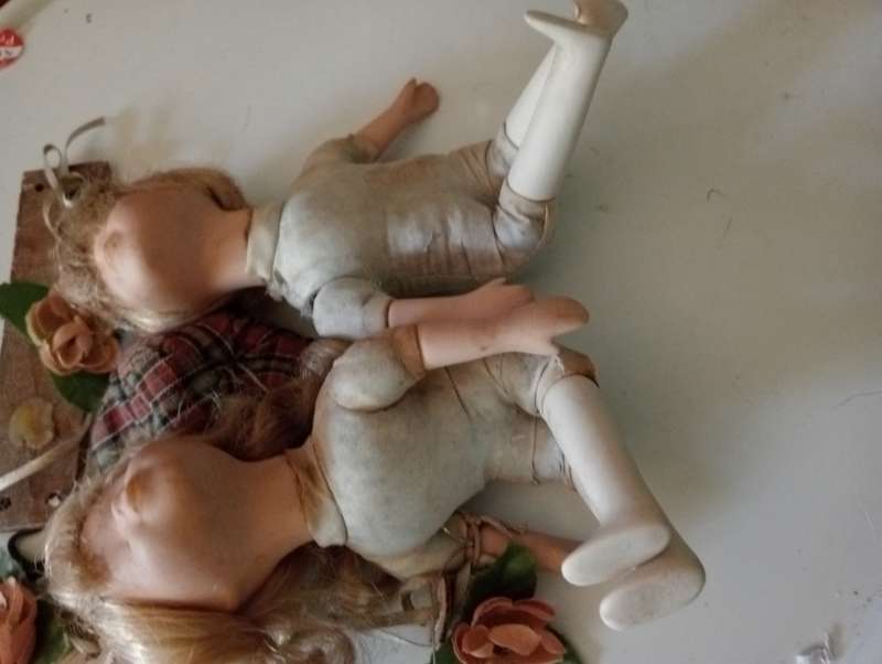2 SMALL ANTIQUE BABY DOLLS ON SWING
