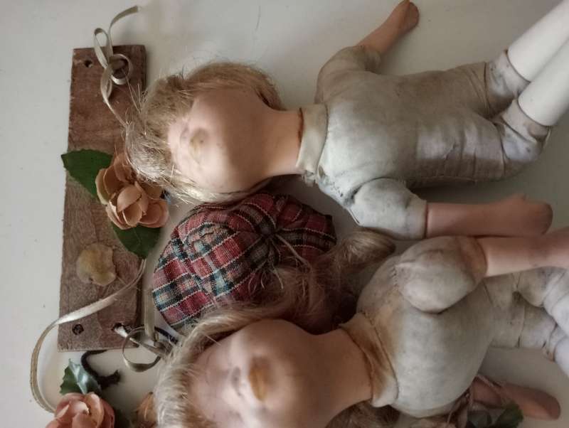2 SMALL ANTIQUE BABY DOLLS ON SWING