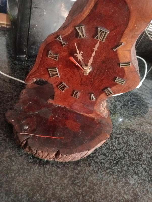 ANTIQUE HANDCRAFTED CLOCK ON WOOD