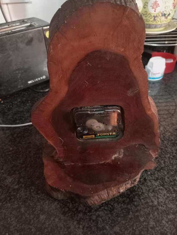ANTIQUE HANDCRAFTED CLOCK ON WOOD