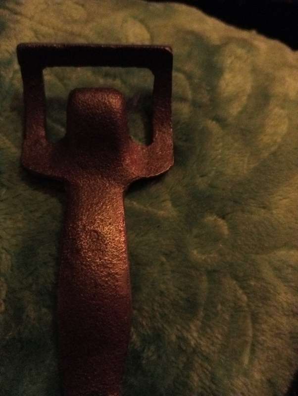 VINTAGE CAST IRON BOTTLE OPENER