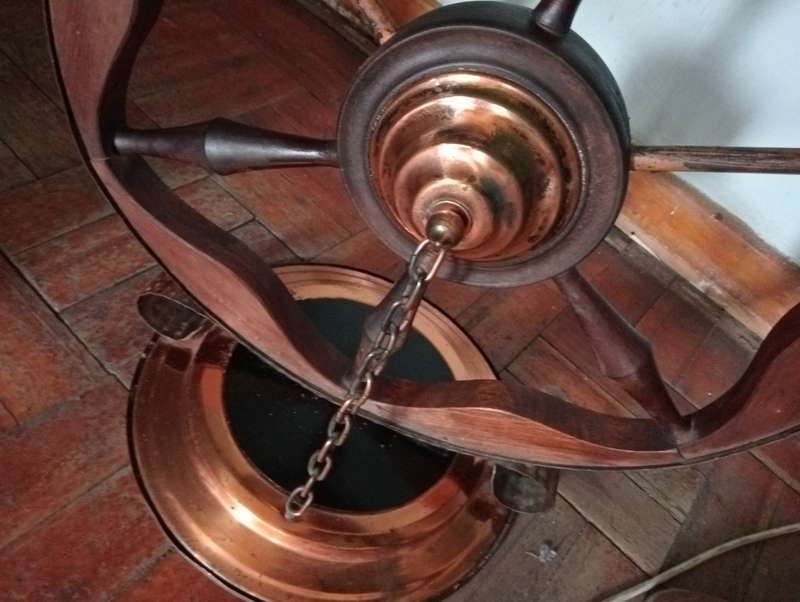 ANTIQUE  INTERESTING HANDMADE WOOD  WHEEL WITH COPPER TRIMMINGS AND COPPER  CHAINS STAND
