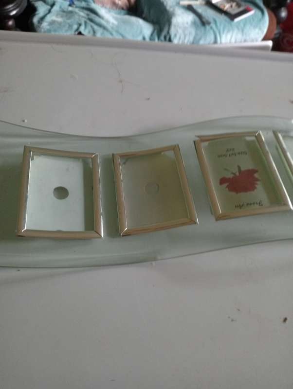 GLASS STAND WITH SMALL PHOTO FRAMES