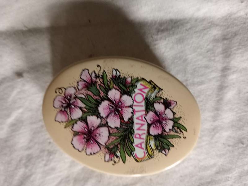 VINTAGE COLLECTABLE SMALL CARNATION TIN