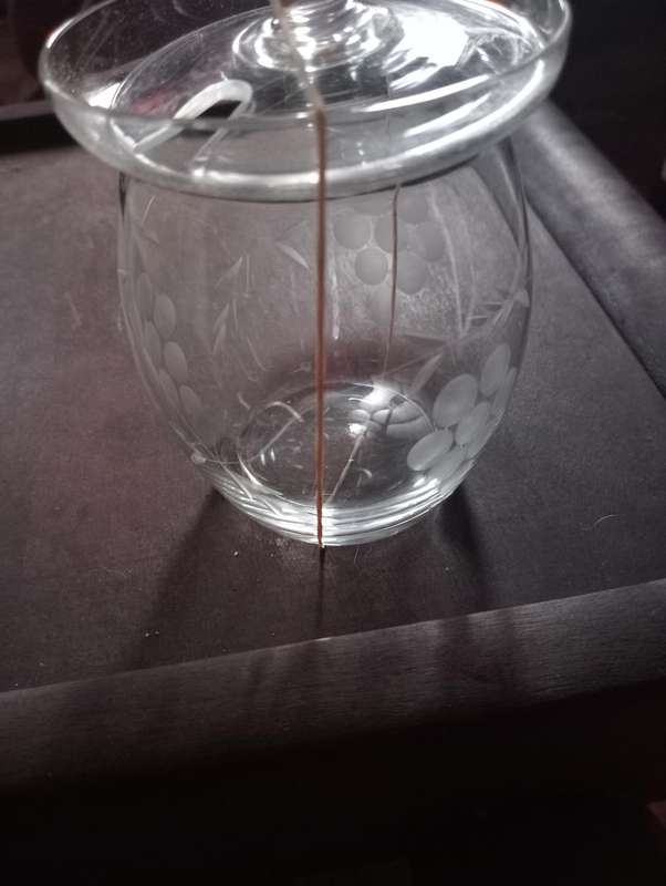 Vintage small glass bottle with lid