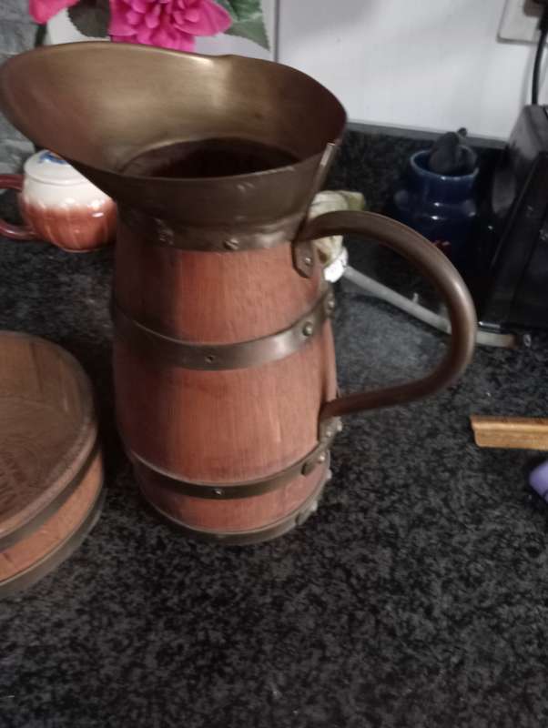 VINTAGE VICEROY  WOOD AND BRASS JUG IN WOODEN STAND