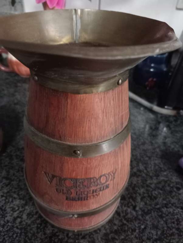 VINTAGE VICEROY  WOOD AND BRASS JUG IN WOODEN STAND