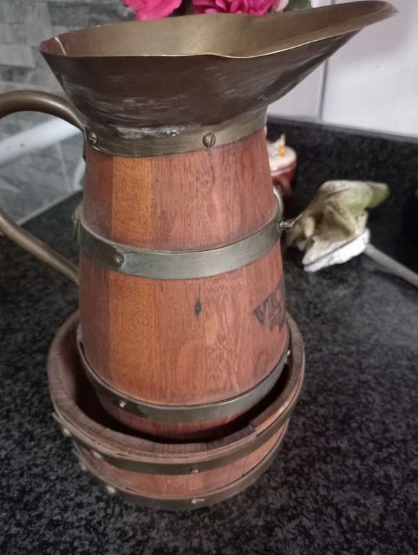 VINTAGE VICEROY  WOOD AND BRASS JUG IN WOODEN STAND