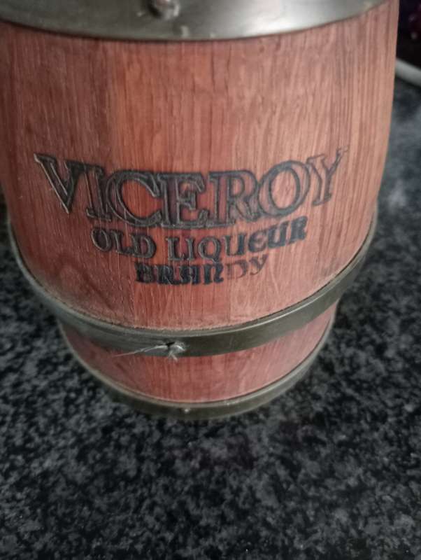 VINTAGE VICEROY  WOOD AND BRASS JUG IN WOODEN STAND