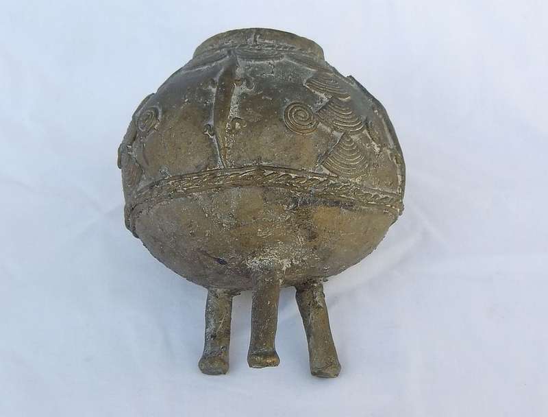 AN OLD WEST AFRICAN TRIBAL BENIN BRONZE URN WITH TRADITIONAL MOTIFS