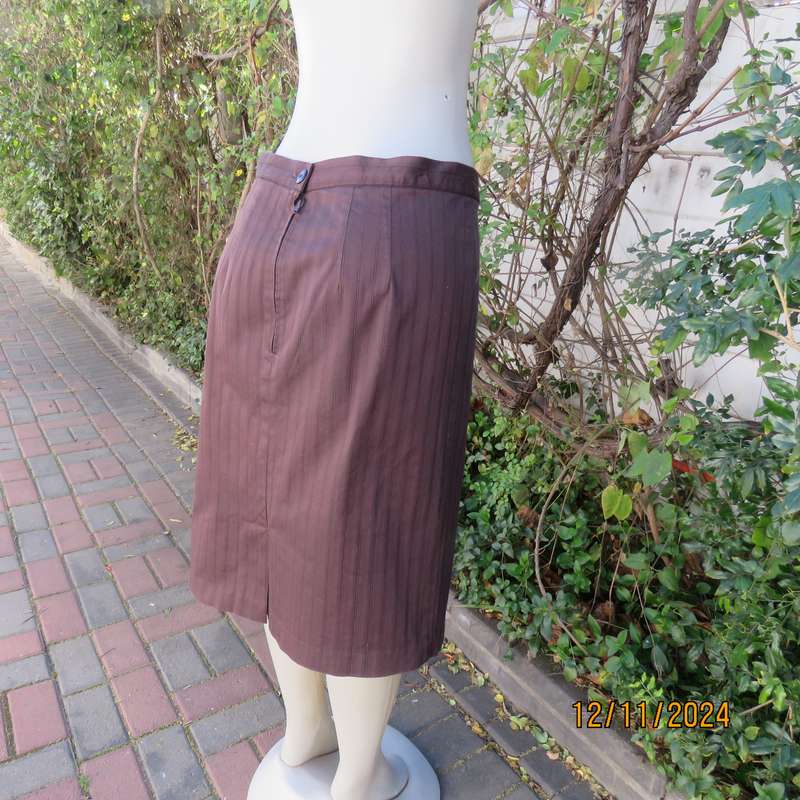 Dark brown striped firm textured stretch polyester pencil lined skirt.Size 38.Zip/pleat at back.