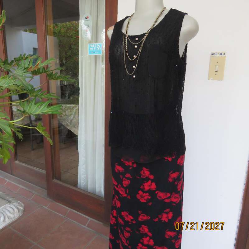 Black sleeveless 2 layer top size 36 with top layer in textured stretch sequined mesh.