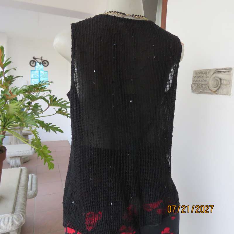 Black sleeveless 2 layer top size 36 with top layer in textured stretch sequined mesh.